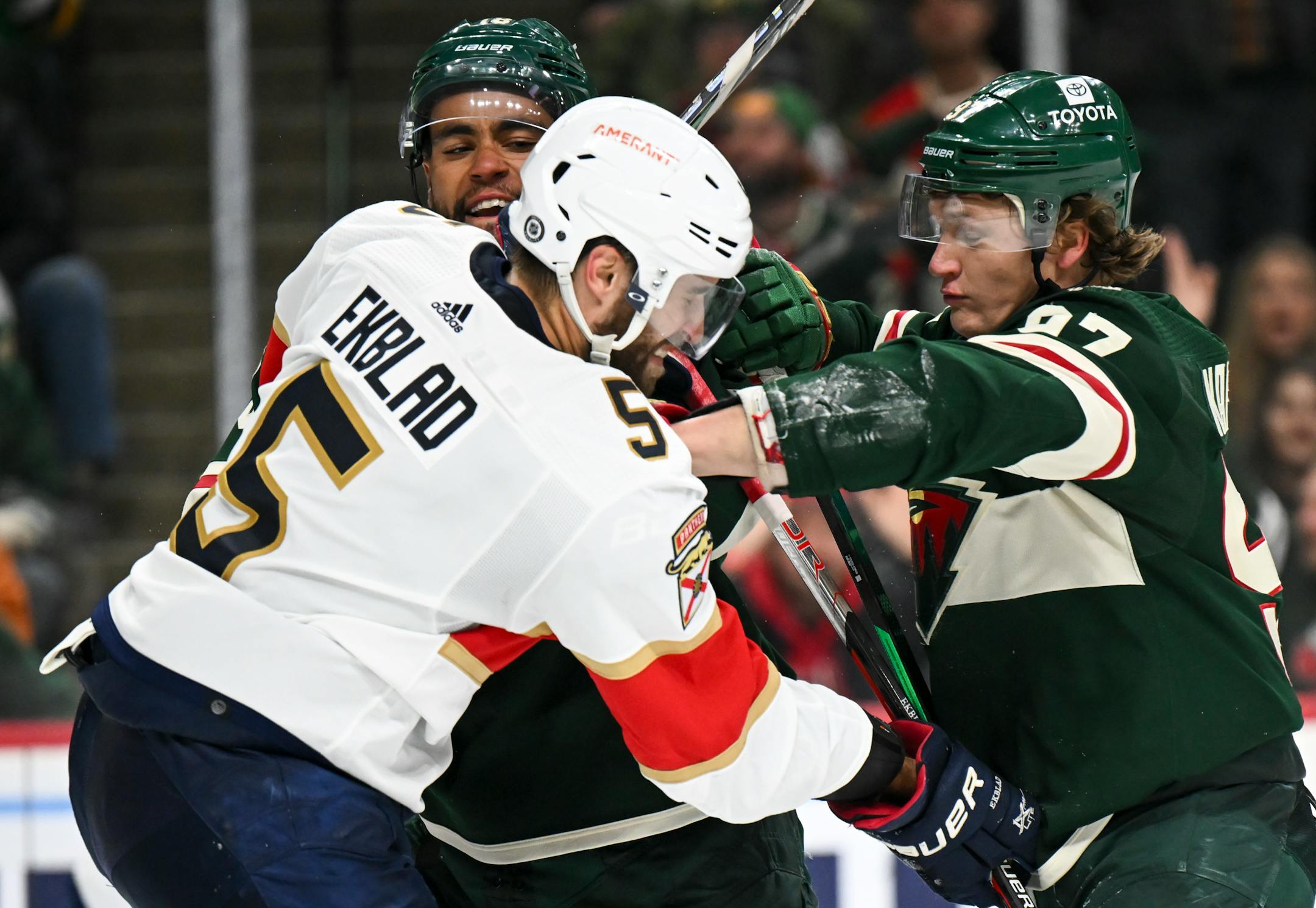 Minnesota Wild left wing Kirill Kaprizov (97) throws a punch at Florida Panthers defenseman Aaron Ekblad (5) during a scuffle during the third period.