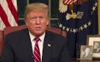 In this image from video, President Donald Trump speaks during a televised address from the Oval Office of the White House in Washington on Tuesday, J