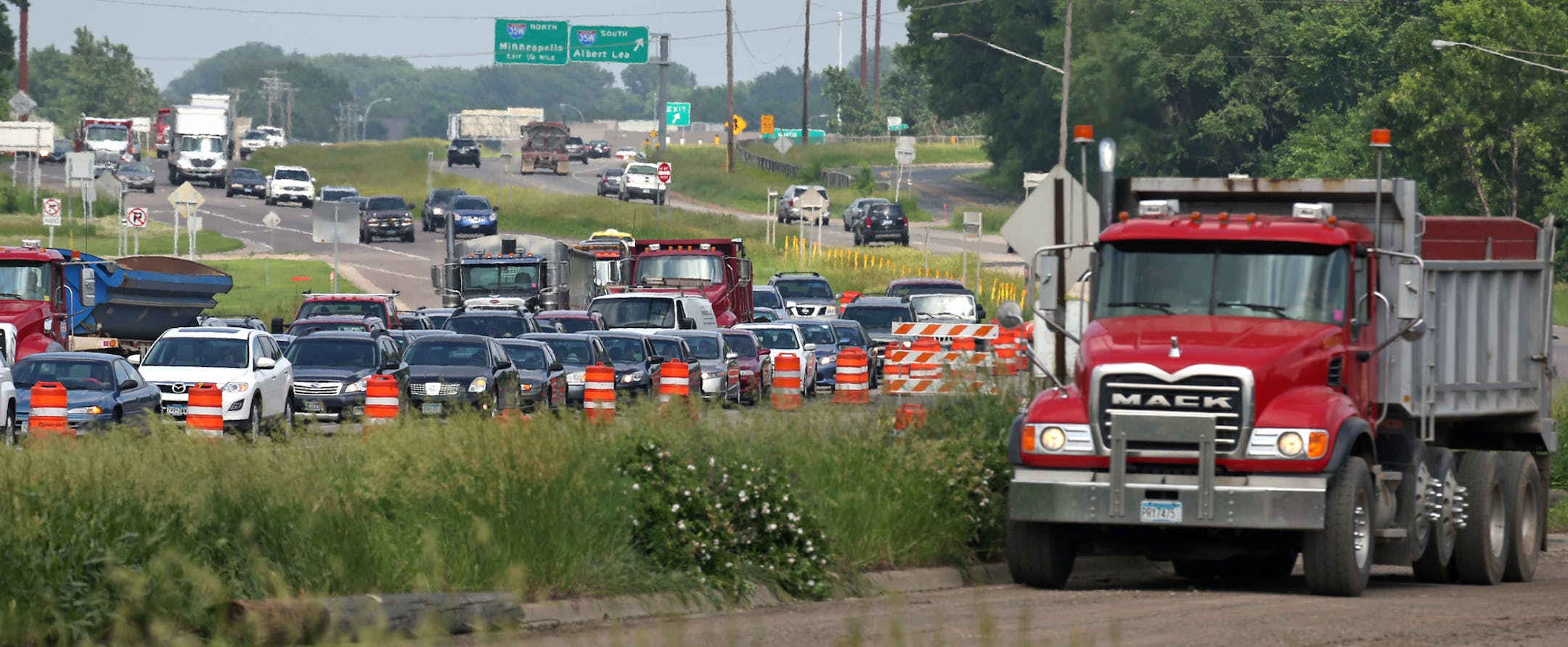 Traffic backed up at the intersection of County Road 5 and Highway 13 in Burnsville, were a new intersection if being built, as construction continued on the access roads, causing heavy traffic congestion on 6/25/13.] Bruce Bisping/Star Tribune bbisping@startribune.com