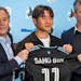 Loons coach Adrian Heath, left, and technical director Mark Watson, right, introduced newcomer Sang Bin Jeong on March 22.