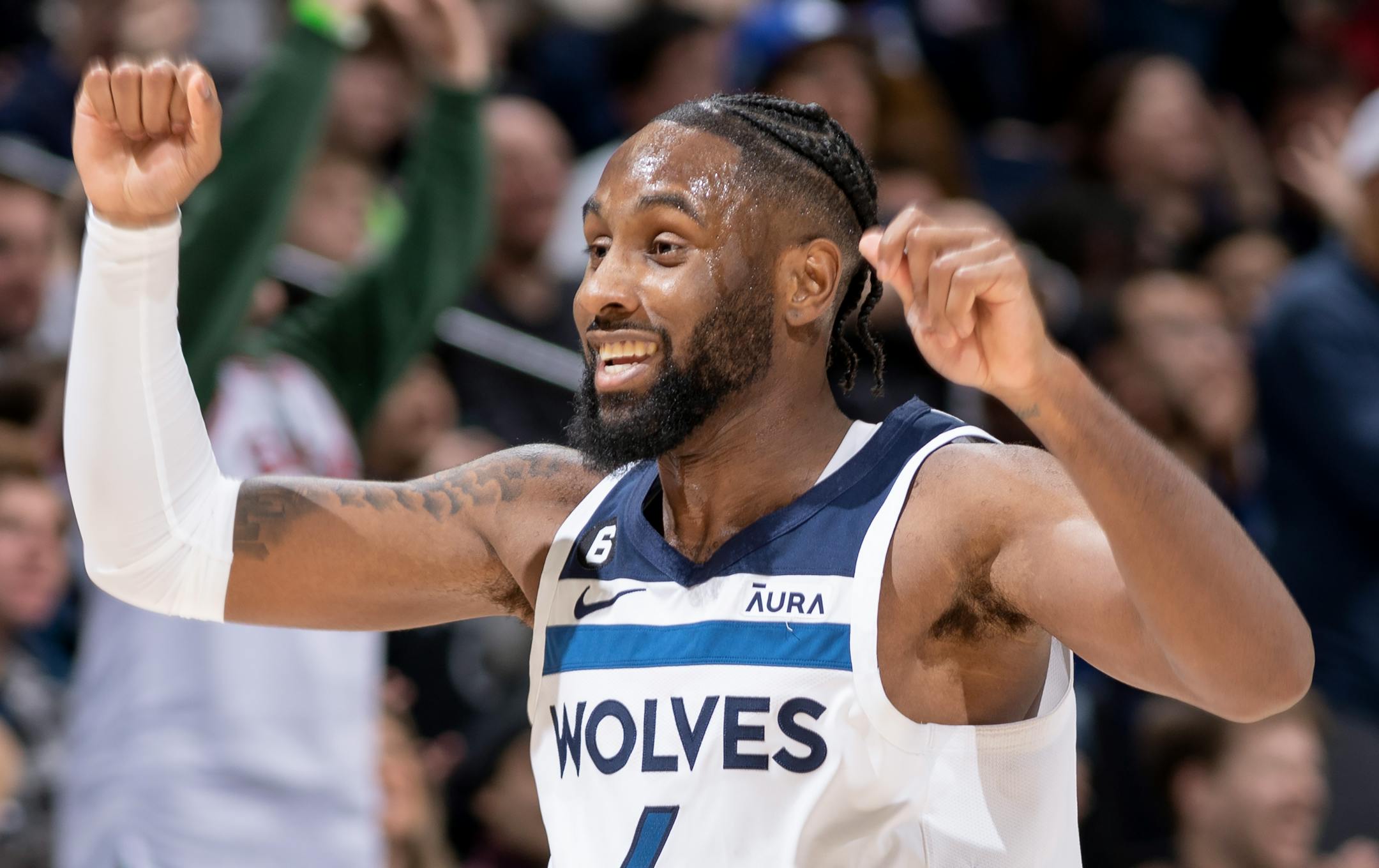 Jaylen Nowell (4) of the Minnesota Timberwolves celebrates a three-point shot in the fourth quarter.