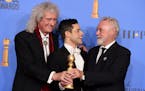 Rami Malek, a Golden Globe winner for playing Queen frontman Freddie Mercury in "Bohemian Rhapsody," celebrated with Mercury's bandmates Brian May and