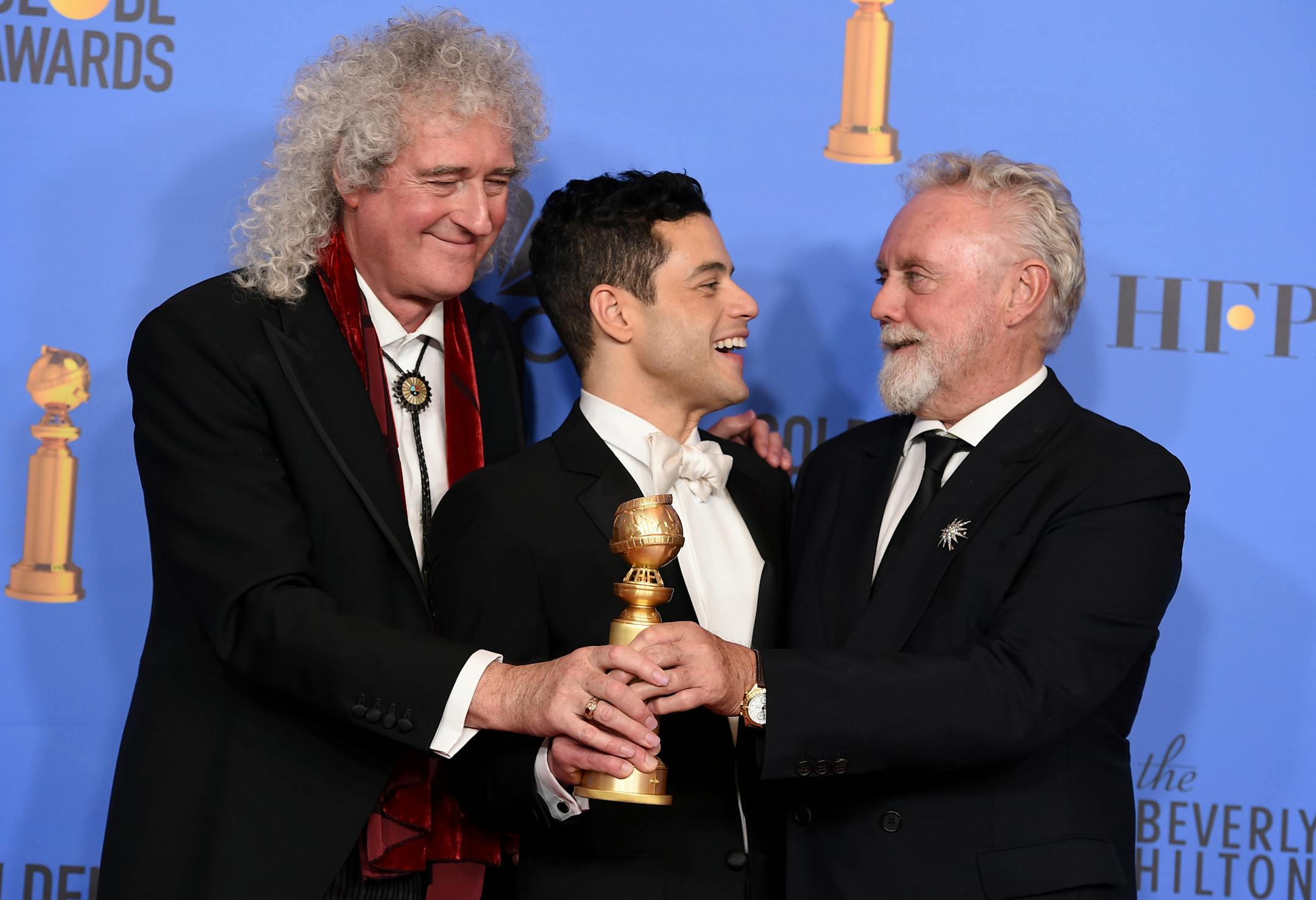 Rami Malek, a Golden Globe winner for playing Queen frontman Freddie Mercury in "Bohemian Rhapsody," celebrated with Mercury's bandmates Brian May and Roger Taylor.