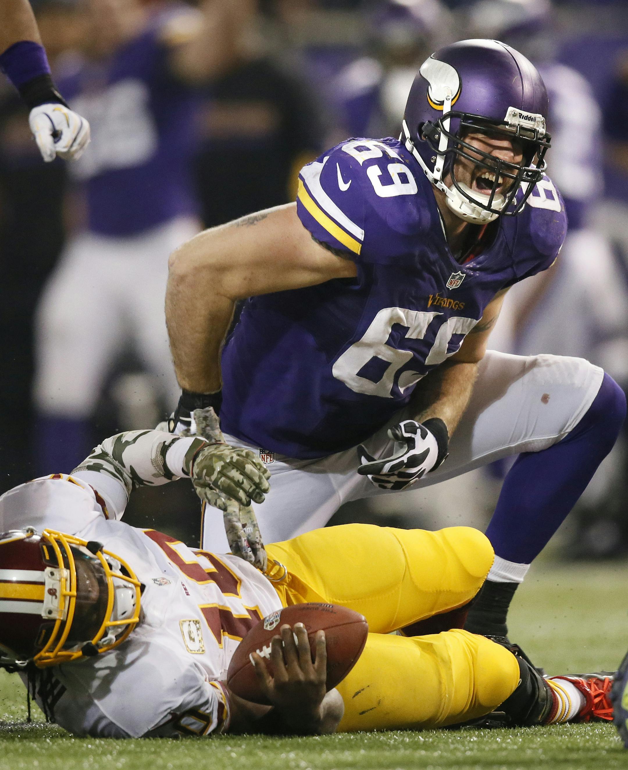 Jared Allen celebrates the 2nd sack in a row in the 4th quarter to stop Washington. ] Minnesota Vikings vs Washington Redskins - Minneapolis Metrodome Minneapolis, WI - 11/07//2013