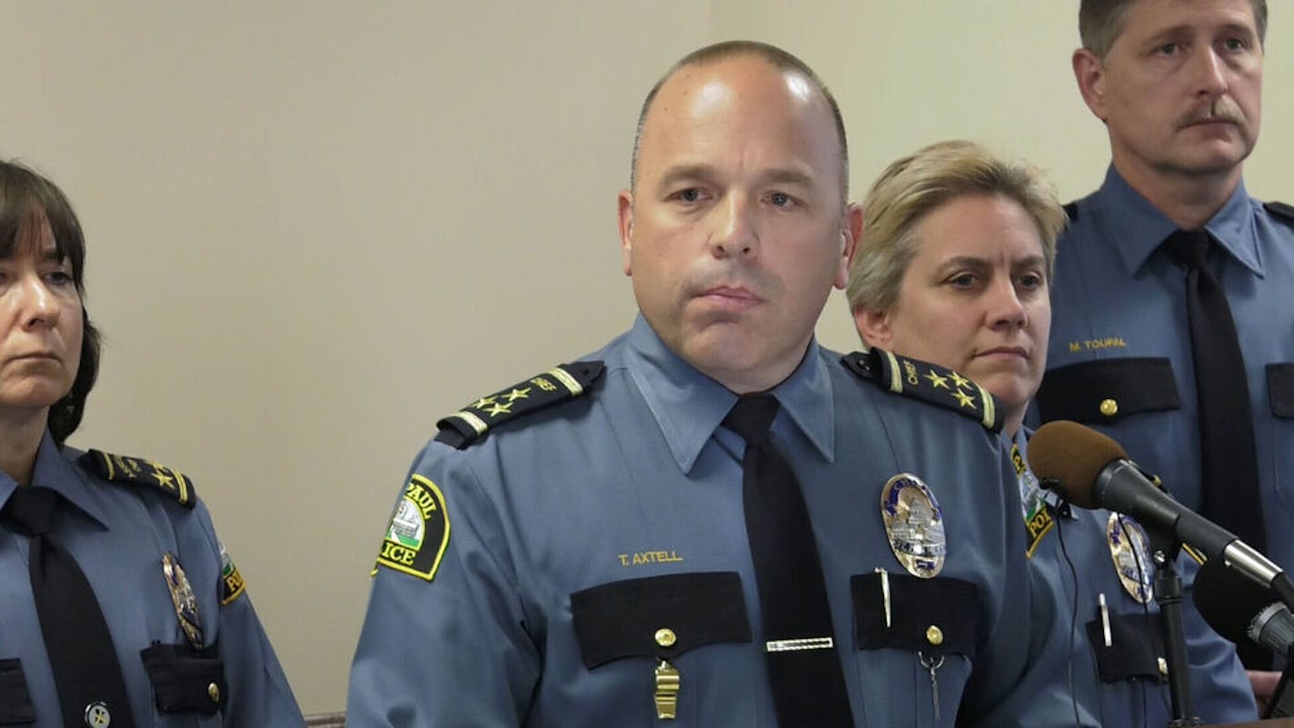 St. Paul Police Chief Todd Axtell, center, held a news conference on Friday, November 4, 2016 to share dashcam video of two police officers disciplined for a June, 2016 incident which included an officer kicking a man while being bitten by a police canine officer. ] SHARI L. GROSS / sgross@startribune.com St. Paul Police Headquarters, St. Paul, Minnesota, Friday, November 4, 2016 ORG XMIT: MIN1611041847591170