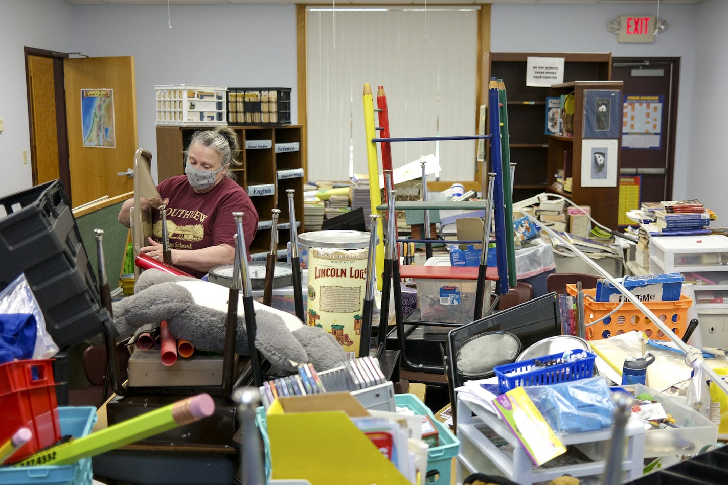 Southview Christian School Principal and teacher, Rayleen Hansen, worked on reorganizing her classroom Wednesday afternoon while preparing for a new school year. A full-school interior painting over the summer left the school a bit of a mess, giving faculty the opportunity to reorganize and clean in anticipation of a possible academic year in the age of COVID-19. ] aaron.lavinsky@startribune.com As public schools anxiously await a state decision on whether they will reopen this fall, private sch