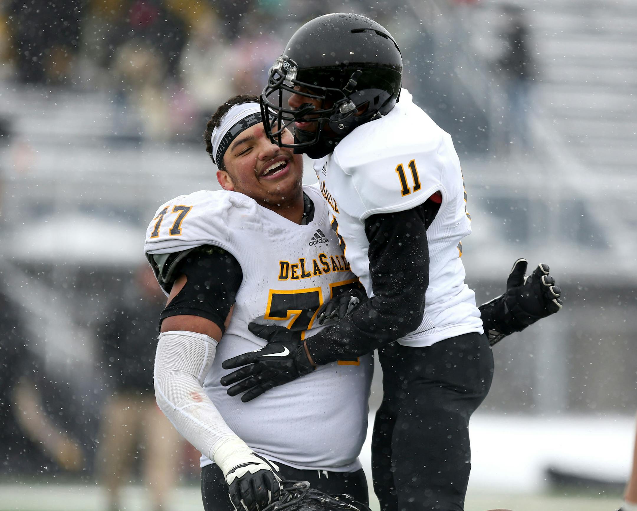 DeLa Salle's J.T. Baker and Keion Tillman celebrated their win against Hutchinson 35-14. ] (KYNDELL HARKNESS/STAR TRIBUNE) kyndell.harkness@startribune.com DeLaSalle vs. Hutchinson state semifinals in Prior Lake, Min., Saturiday, November 15, 2014.