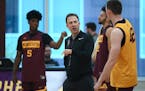 Gophers basketball coach Richard Pitino spoke to forward Michael Hurt (42) during a recent practice. Both Pitino and Hurt will appear at Big Ten media