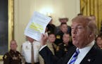 President Donald Trump responds to a reporters question during an event with sheriffs in the East Room of the White House in Washington, Wednesday, Se