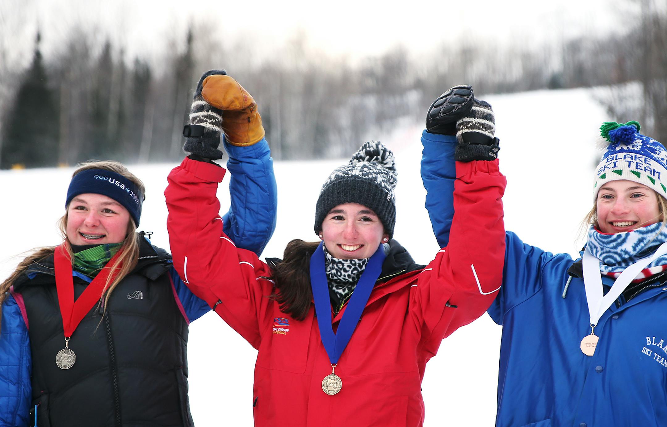Nellie Ide of The Blake School in Minneapolis won third place, from left, Kate Hanson of Rochester Century won first place and Rosie Hust of Orono won second place in the Alpine State Ski Meet in Biwabik on Wednesday, February 11, 2015. ] LEILA NAVIDI leila.navidi@startribune.com /