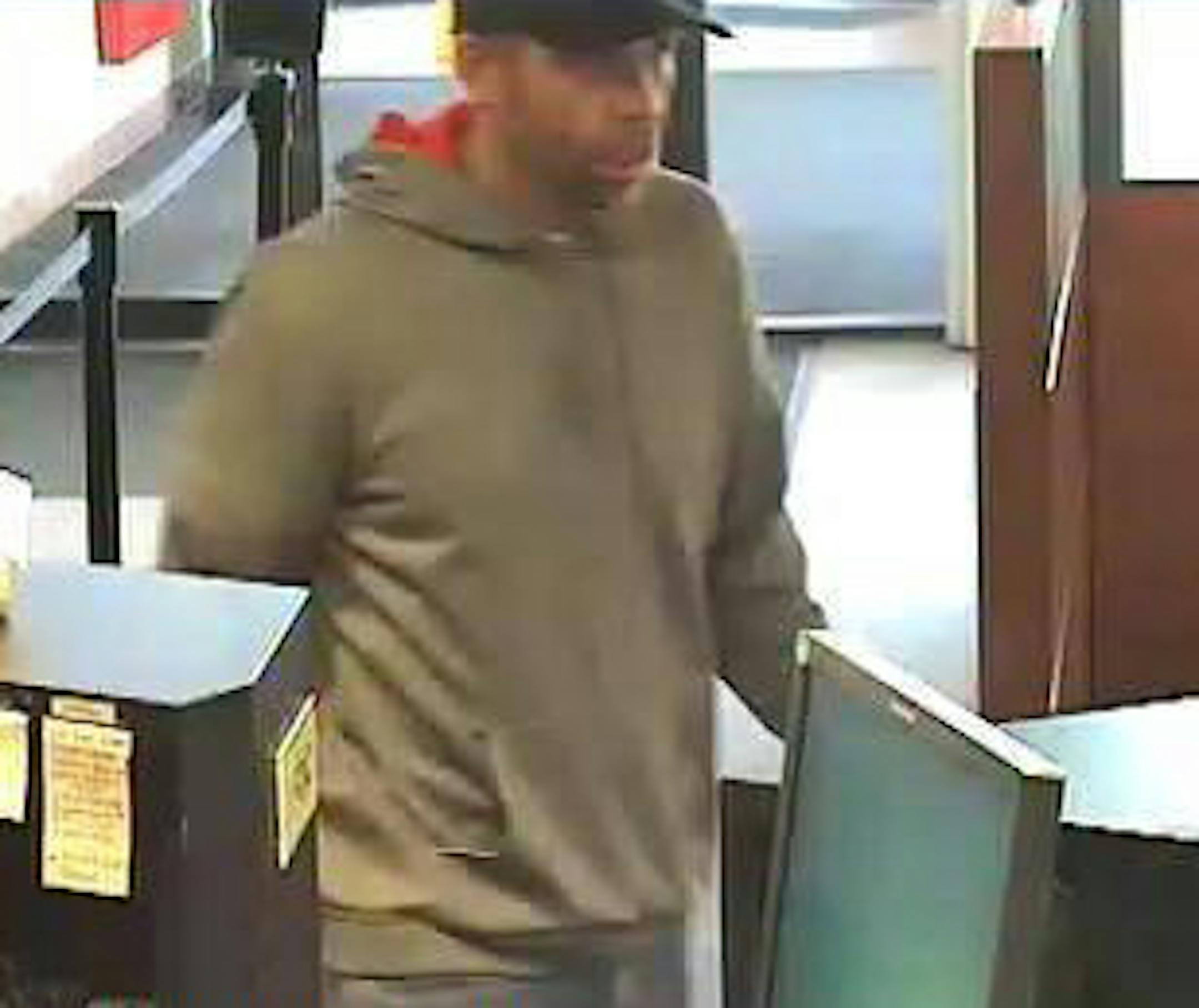 This man, shown in surveillance images robbing a Maple Grove bank Tuesday, also hit a bank about 90 minutes earlier in Burnsville.