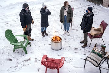 Mike Zontelli, right, met with his daughter and friends outside at his home in Minnetonka. Zontelli is a kidney transplant recipient, which makes him 