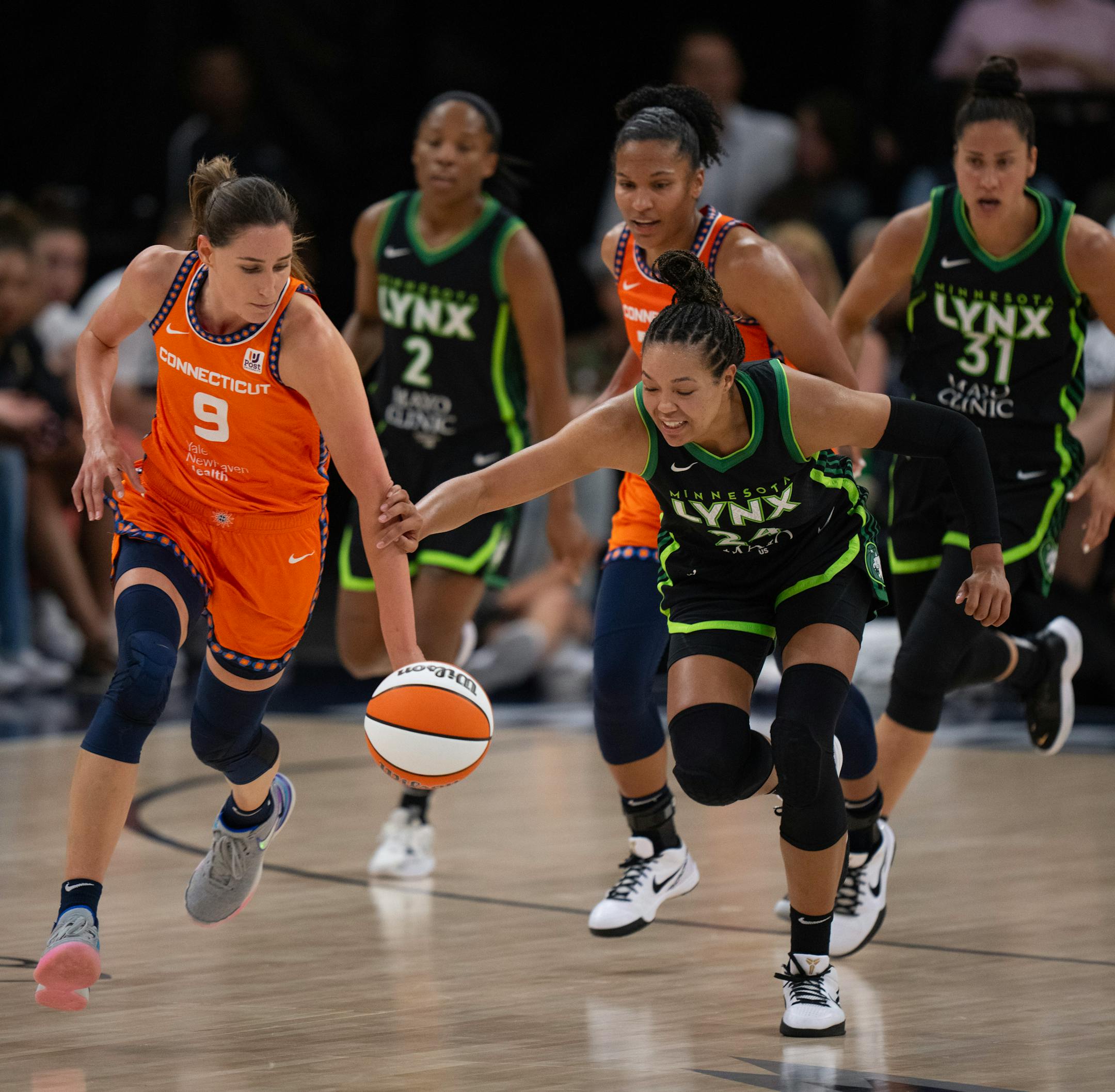Connecticut Sun guard Rebecca Allen (9) beat Minnesota Lynx forward Napheesa Collier (24) to a loose ball in the third quarter Thursday night. The Minnesota Lynx lost to the Connecticut Sun 89-68 in a WNBA game Thursday night, June 22, 2023 at Target Center in Minneapolis.