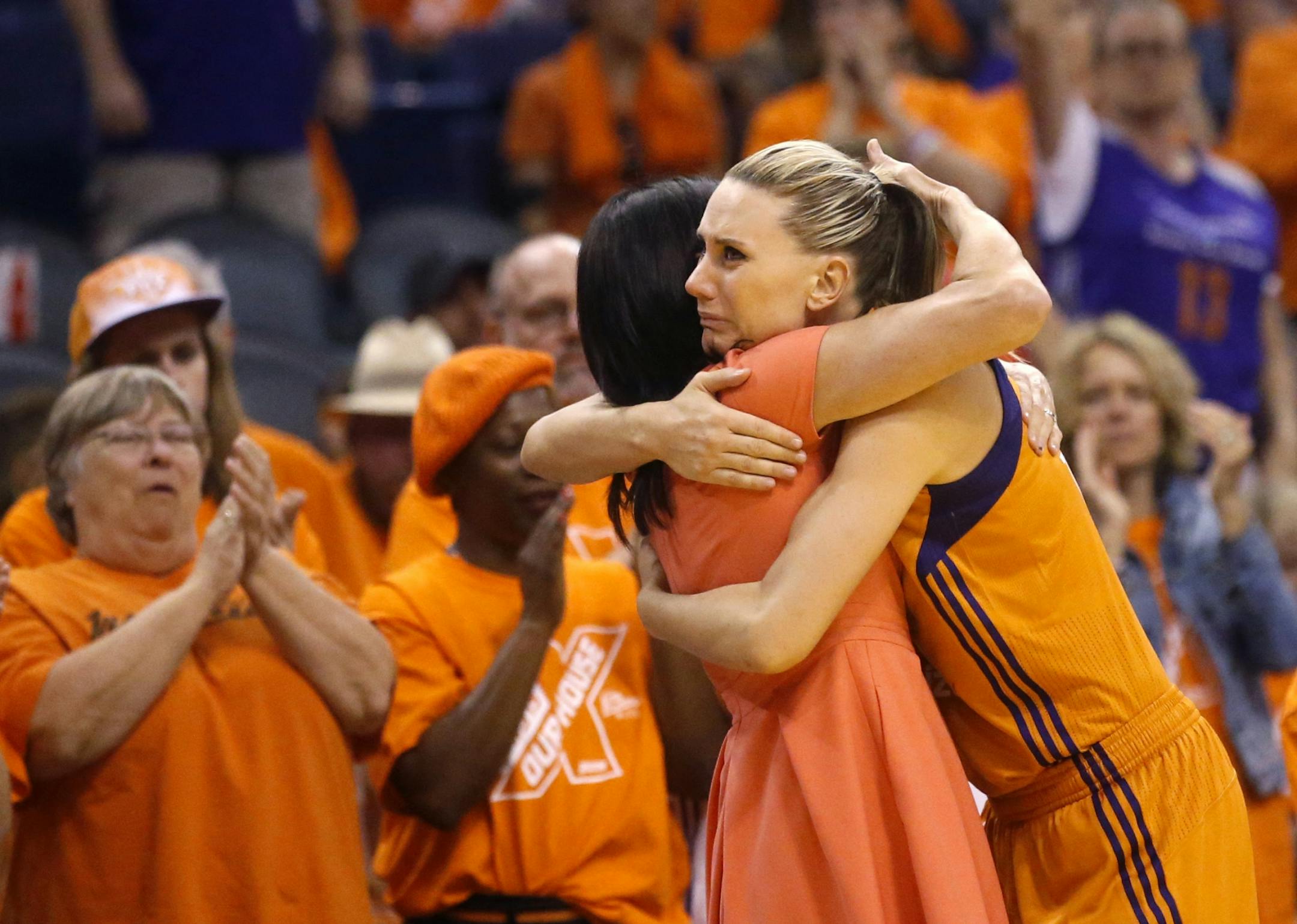 Phoenix Mercury head coach Sandy Brondello hugs forward Penny Taylor after losing to the Minnesota Lynx, 82-67, after game 3 of the WNBA basketball semifinals in Scottsdale, Ariz., Sunday, Oct. 2, 2016.