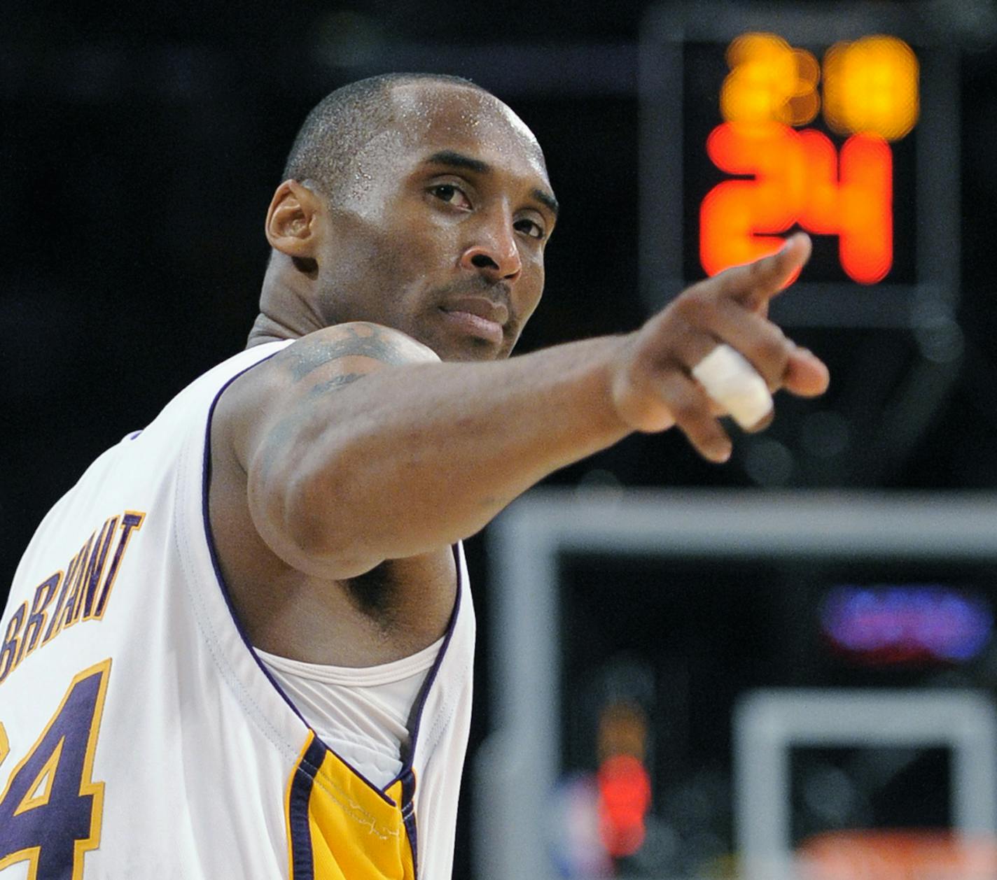 FILE - In this June 7, 2009 file photo Los Angeles Lakers guard Kobe Bryant (24) points to a player behind him after making a basket in the closing seconds against the Orlando Magic in Game 2 of the NBA basketball finals in Los Angeles. Bryant, the 18-time NBA All-Star who won five championships and became one of the greatest basketball players of his generation during a 20-year career with the Los Angeles Lakers, died in a helicopter crash Sunday, Jan. 26, 2020. He was 41. (AP Photo/Mark J. Ter