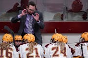 Minnesota head coach Brad Frost talked with his players as they headed into overtime after the third period. ] ANTHONY SOUFFLE • anthony.souffle@sta