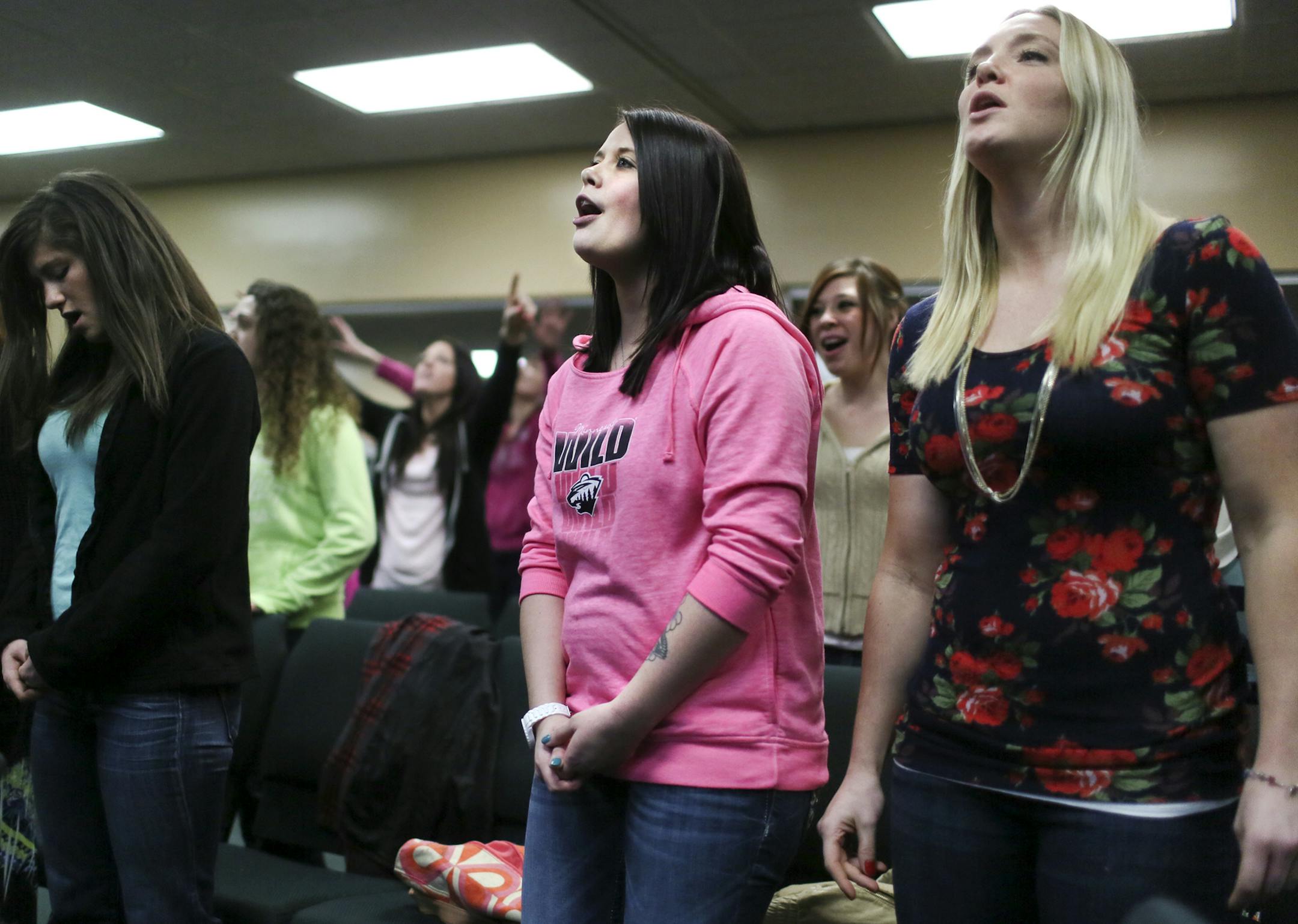 Lauren Waldemar, 21, center, during choir practice at Mn Adult and Teen Challenge Wednesday, Feb. 19, in Minneapolis, MN. The long-term faith-based recovery program for those struggling with alcohol and drug addiction is but one of several recovery programs Waldemar has tried, but this time Waldemar, as well as her parents, believe she is headed in the right direction. Waldemar, who was effected by the divorce of her parents at age 12, used alcohol at a young age and progressed to oxycodone at a