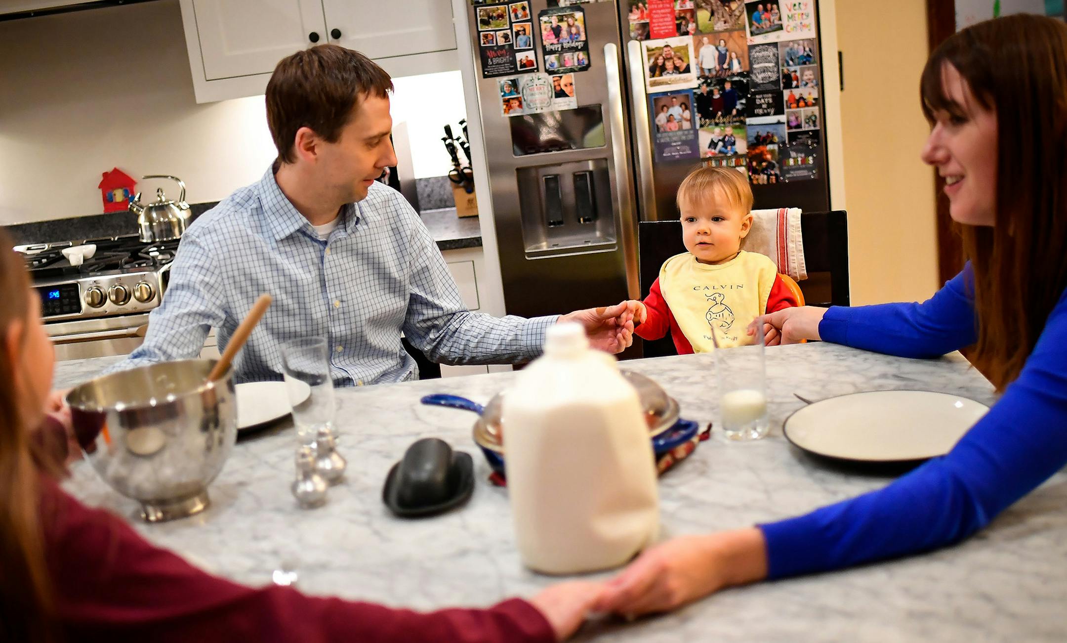 Chris and Ann Carda prayed with their two children, Alexandra and Harrison, before dinner in their home in St. Louis Park Wednesday. ] (AARON LAVINSKY/STAR TRIBUNE) aaron.lavinsky@startribune.com When Ann and Chris Carda learned that they were unable to have another child, an angel descended upon their church to help them. A fellow parishioner offered to carry the couple&#x2019;s baby, in an act the surrogate mother called one of friendship and faith. But under recommendations of a legislative t
