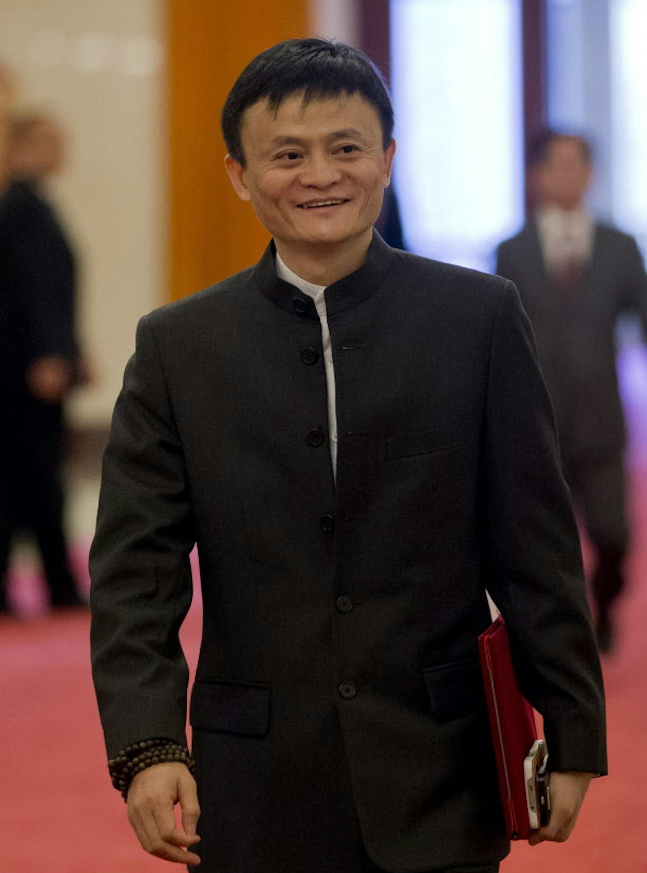 In this June 11, 2014 photo, Jack Ma, founder and executive chairman of Alibaba Group arrives for a meeting at the Great Hall of the People in Beijing, China. Foreigners who want to buy Alibaba Group shares in the Chinese e-commerce giantís U.S. public offering will need to get comfortable with an unusual business structure. (AP Photo/Andy Wong)