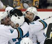 San Jose Sharks' Justin Braun, right, celebrates his goal against the Pittsburgh Penguins with teammates during the third period in Game 2 of the NHL 