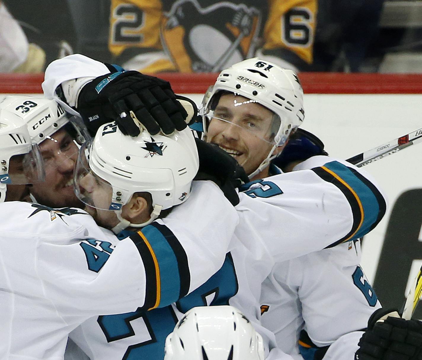 San Jose Sharks' Justin Braun, right, celebrates his goal against the Pittsburgh Penguins with teammates during the third period in Game 2 of the NHL hockey Stanley Cup Finals on Wednesday, June 1, 2016, in Pittsburgh. (AP Photo/Gene J. Puskar)