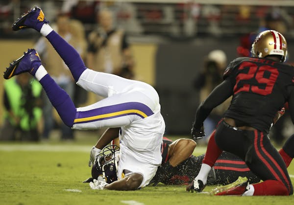 Vikings quarterback Teddy Bridgewater (5) was sacked for a 14 yard loss by San Francisco 49ers strong safety Jaquiski Tartt (29) in the first quarter 
