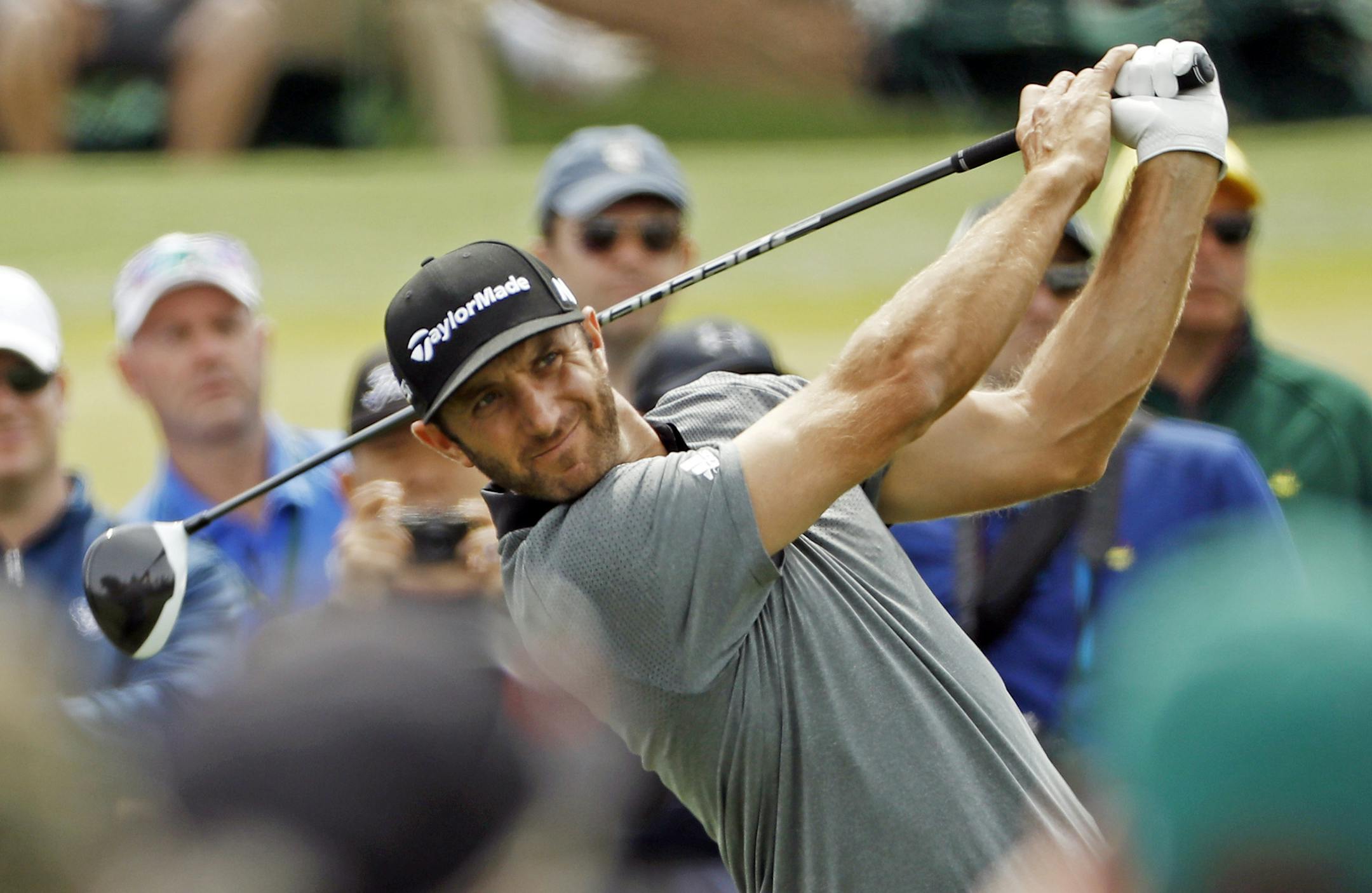 Dustin Johnson tees off on the third hole during the par three competition at the Masters golf tournament Wednesday, April 6, 2016, in Augusta, Ga. (AP Photo/David J. Phillip)