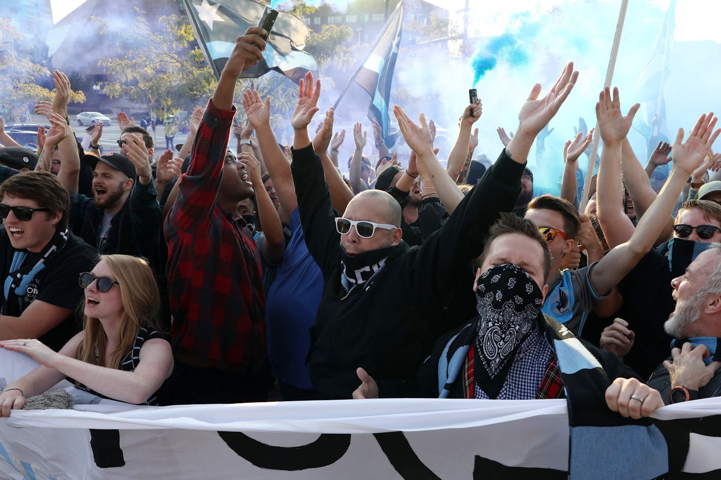 Minnesota United fans sing songs and burn blue smoke bombs as they march into TCF Bank Stadium in Minneapolis before a game against the Philadelphia Union on Saturday, Sept. 9, 2017. (Anthony Souffle/Minneapolis Star Tribune/TNS)