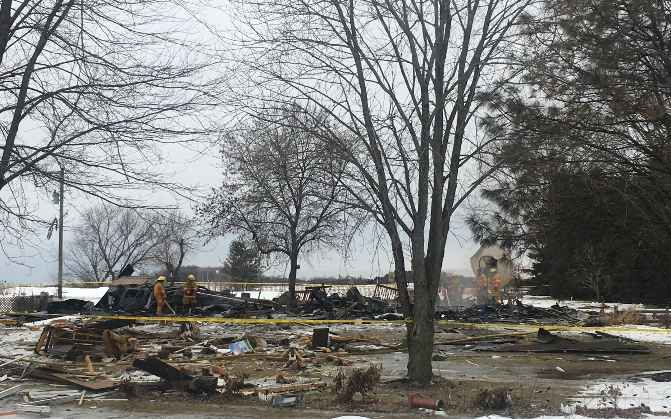 Firefighters continue to watch for flare-ups at the site where a house exploded Tuesday morning in the southern Dakota County community of Hampton.