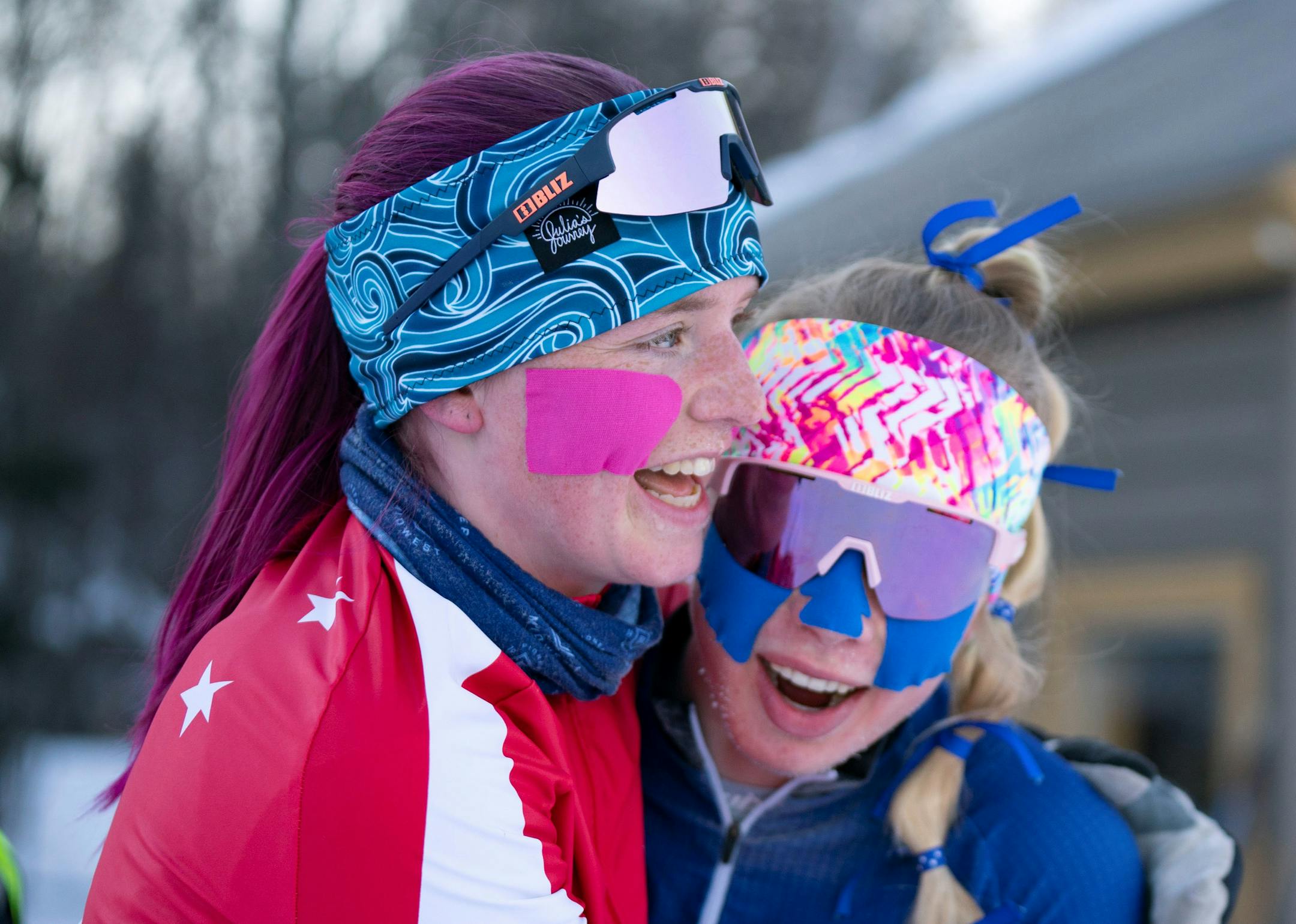 St. Paul Highland Park skier Molly Moening embraces Hopkins skier Sydney Drevlow, left to right, at the finish line of the girls 5k freestyle pursuit race at the Minnesota State High School League Boys and Girls Nordic Ski Racing State Meet Thursday, Feb. 17, 2022 at Giants Ridge in Biwabik, Minn. Moening had won the previous two gold medals and celebrated with Drevlow after coming in third place. ]