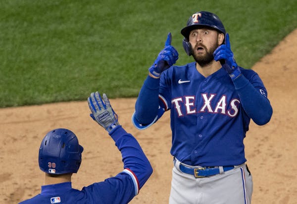 Joey Gallo of the Texas Rangers celebrated as he crossed the plate after hitting a homer in the ninth inning.