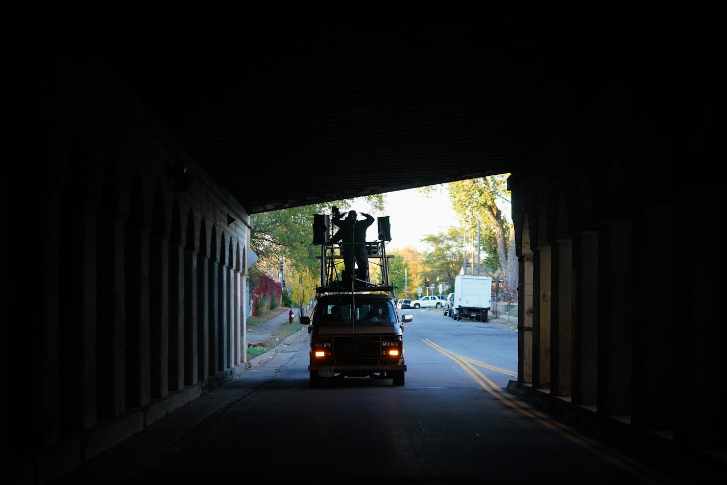 The "Bands on Vans" vehicle carrying Nur-D and DJ Hayes on the roof stage drove through an underpass en route to Grumpy's.