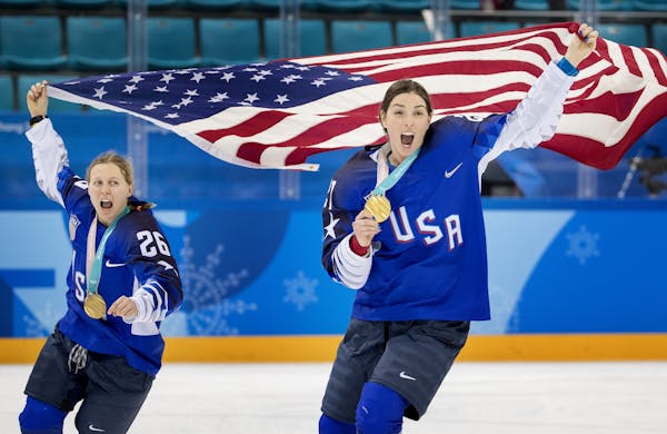 Kendall Coyne (26) and Hilary Knight (21) celebrated at the end of the game.
