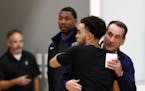 Duke and Team USA head coach Mike Krzyzewski gave a hug to former Duke and Apple Valley star Tyus Jones at Tuesday's Wolves practice.