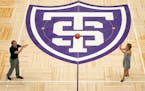 St Thomas men's basketball coach John Tauer and women's coach Ruth Sinn stepped out for the first time onto the newly unveiled basketball court. They 