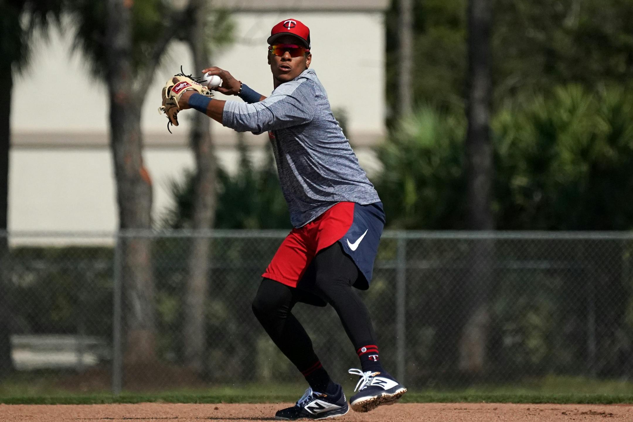 Minnesota Twins shortstop Jorge Polanco (11) practiced throwing to first with the few field players present at Spring Training Saturday.