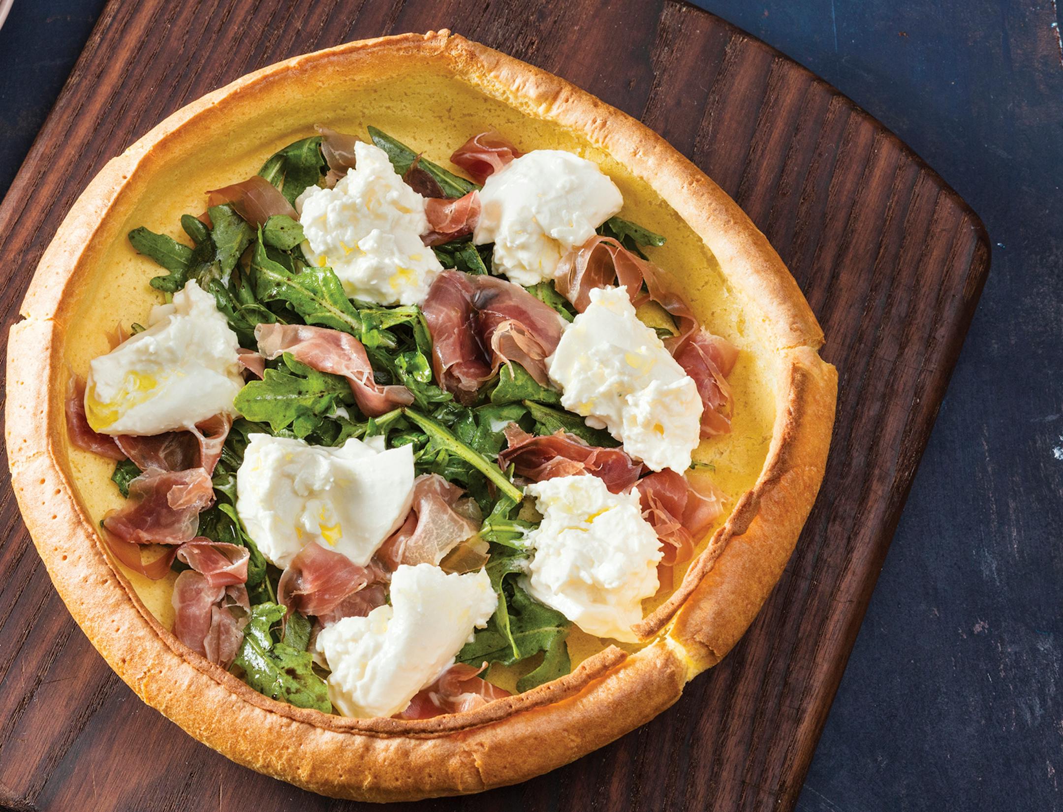 A Dutch Baby renaissance has led to an array of new flavors, including this one from America's Test Kitchen with burrata and prosciutto. Credit: Daniel J. van Ackere