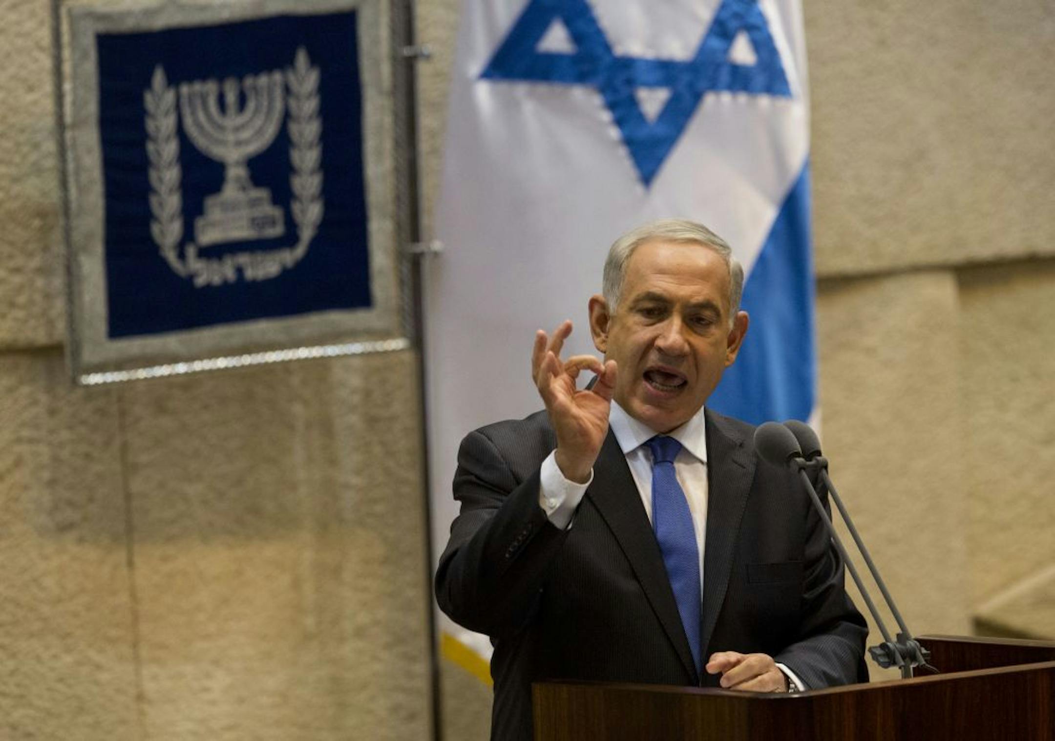 Israel's Prime Minister Benjamin Netanyahu speaks during the opening session of the Knesset, Israel's parliament, Monday, Oct. 14, 2013. Israel�s prime minister says he is making a �real effort� to reach peace with the Palestinians, but is giving no signs of progress in recently relaunched negotiations. In a speech to parliament on Monday, Netanyahu vowed to maintain a hard line in the negotiations.