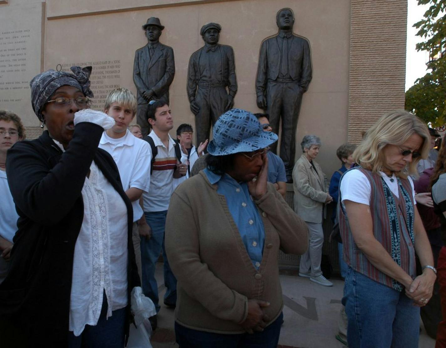 Duluth MN. 10/10/2003 Friday Clayton, Jackson, McGhie Memorial was dedicated during a ceremony, Friday, Oct. 10, 2003, in Duluth, Minn. l to r Darlene Green and her mother Lela Elfundi of Duluth react emotionaly during the dedication ceremony. Both talked about how frustrating the tragedy was and feel not enough has been done for the hanged men's family.