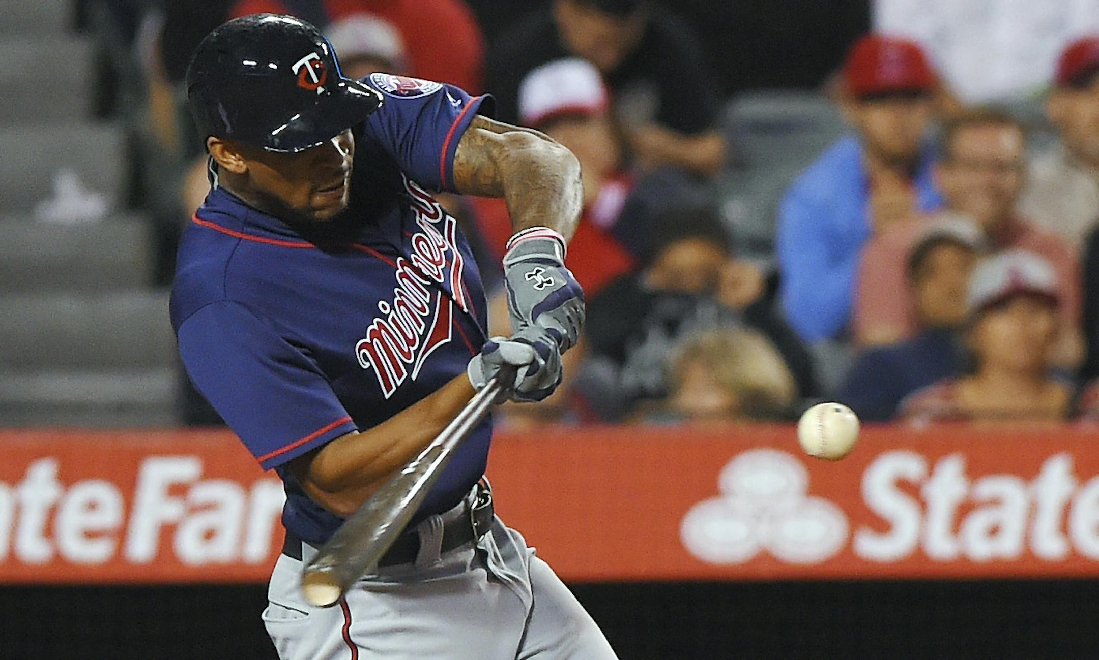 Minnesota Twins' Byron Buxton hits a solo home run as Los Angeles Angels catcher Carlos Perez watches during the sixth inning of a baseball game Monday, June 13, 2016, in Anaheim, Calif. (AP Photo/Mark J. Terrill) ORG XMIT: MIN2016061323335843