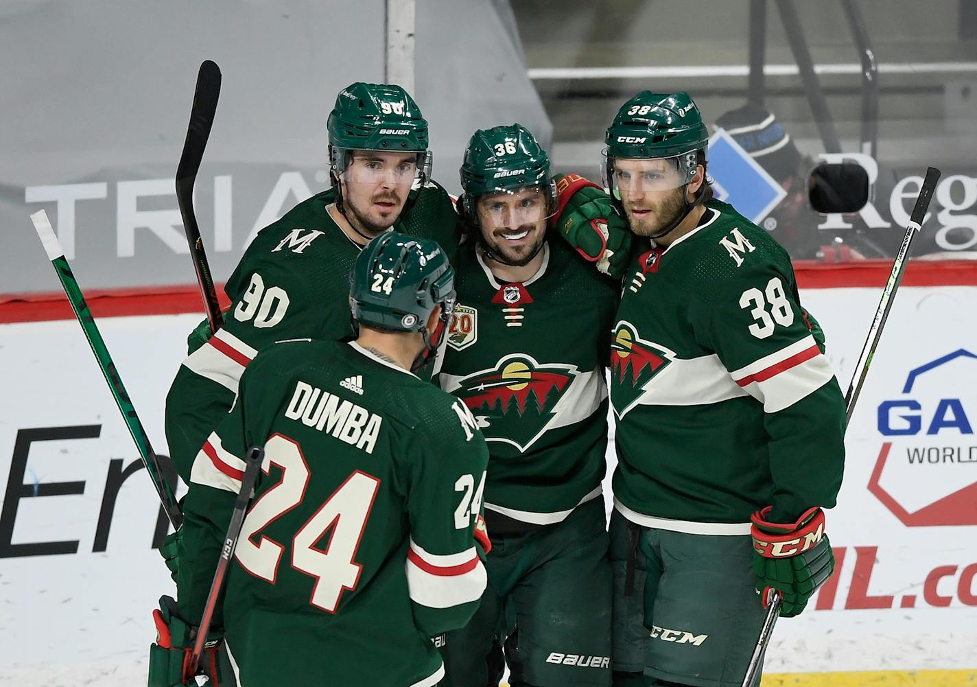 From left, the Minnesota Wild's Marcus Johansson, Matt Dumba, Mats Zuccarello and Ryan Hartman celebrate a goal against the San Jose Sharks by Zuccarello during the first period at Xcel Energy Center on Saturday, April 17, 2021 in St. Paul, Minnesota. The Wild won, 5-2. (Hannah Foslien/Getty Images/TNS) ORG XMIT: 14029468W