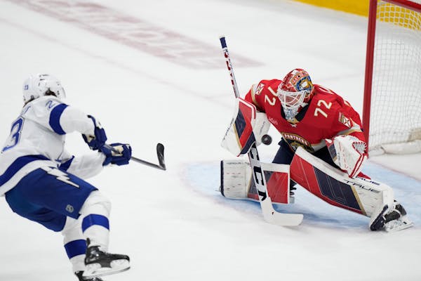 Lightning center Michael Eyssimont (23) attempts a shot at Panthers goaltender Sergei Bobrovsky (72) during the first period Sunday.