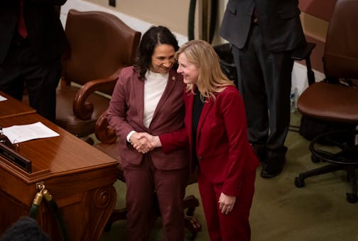 Lisa Demuth shakes Melissa Hortman’s hand after being elected speaker at the Minnesota State Capitol in St. Paul on Feb. 6.