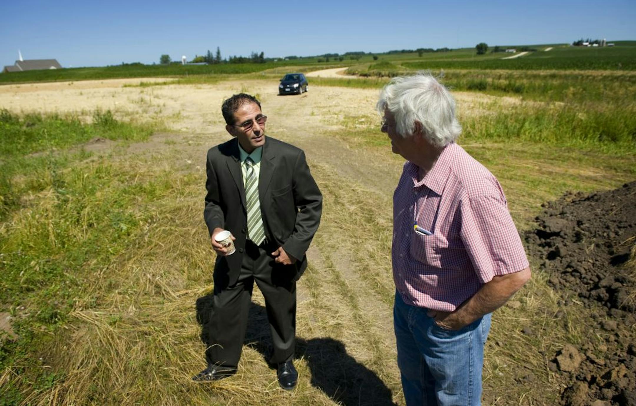 Pine Island city administrator Abraham Algadi left, and planning and zoning chairman Jerry Vettel looked over the site of the first building location in the Elk Run Biotechnology Center.