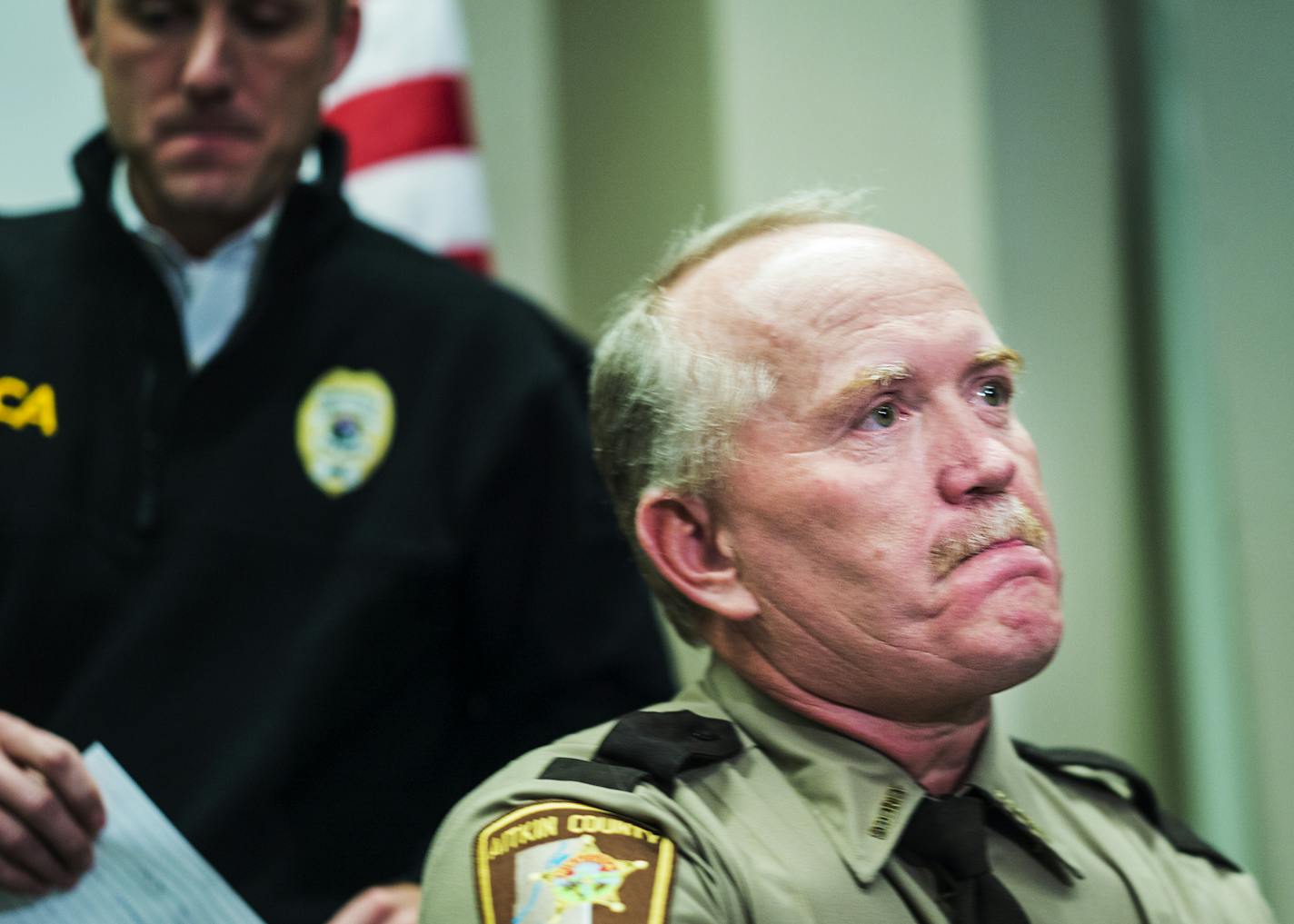 At St. Cloud police headquarters, Aitkin County Sheriff Scott Turner was visibly upset as BCA Superintendent Drew Evans described how Sheriff's deputy Steven Sandburg was killed in a shooting at the St. Cloud Hospital.