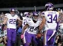 Vikings cornerback Captain Munnerlyn (24) celebrated an interception by teammate Andrew Sendejo (34) in the first quarter against the Eagles on Sunday