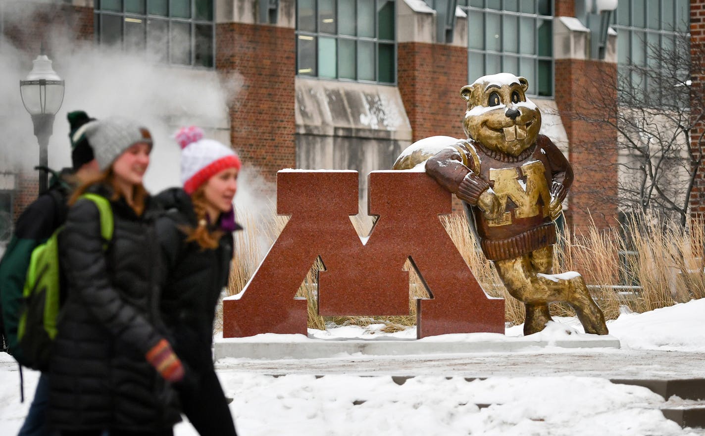 Students walk past Goldy Gopher on the University of Minnesota east bank campus. ] GLEN STUBBE * gstubbe@startribune.com Friday, December 16, 2016 Taking the pulse of students, staff, donors at the University of Minnesota in the aftermath of the football team's boycott of a coming bowl game following the suspension of 10 players off a sexual assault allegation in September. ORG XMIT: MIN1612161503341888