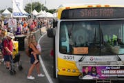 Fairgoers waited in long lines Tuesday to board buses at the Minnesota State Fair’s Transportation Hub in Falcon Heights.