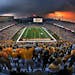 Fans enjoyed a dramatic sunset over the Minneapolis skyline as they watched the Golden Gophers played Air Force in the inaugural football game at the 