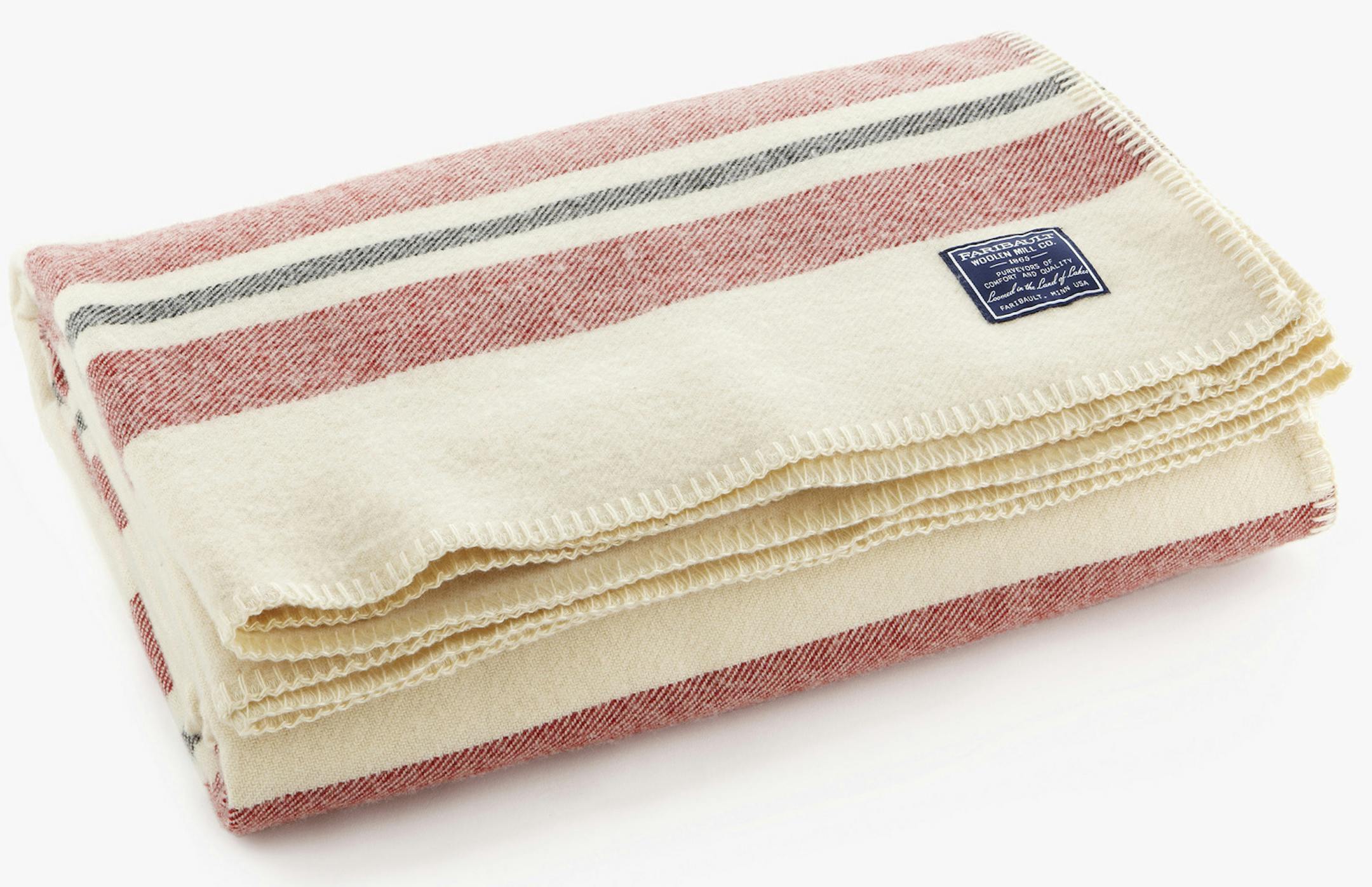 Cabin blanket- natural A new, first-quality American Flag throw from Faribault Woolen Mill is $190 or $55 for second quality at the tent sale. Cabin Wool blankets in natural that range from $250 to $380 new, depending on size, will be $40 to $65 for seconds at the sale. A new Revival Stripe blanket in bone white is $400 in queen size but $100 at the seconds sale Friday and Saturday.